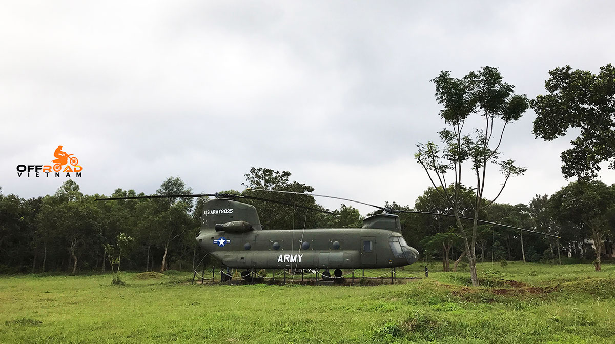 Vietnam Offroad Tours motorbike voyage down Ho Chi Minh trail. US Navy helicopter in open air museum in Khe Sanh.