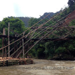 Vietnam dirt bike tours over a bamboo bridge