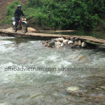 Vietnam dirt bike tours over a bamboo bridge